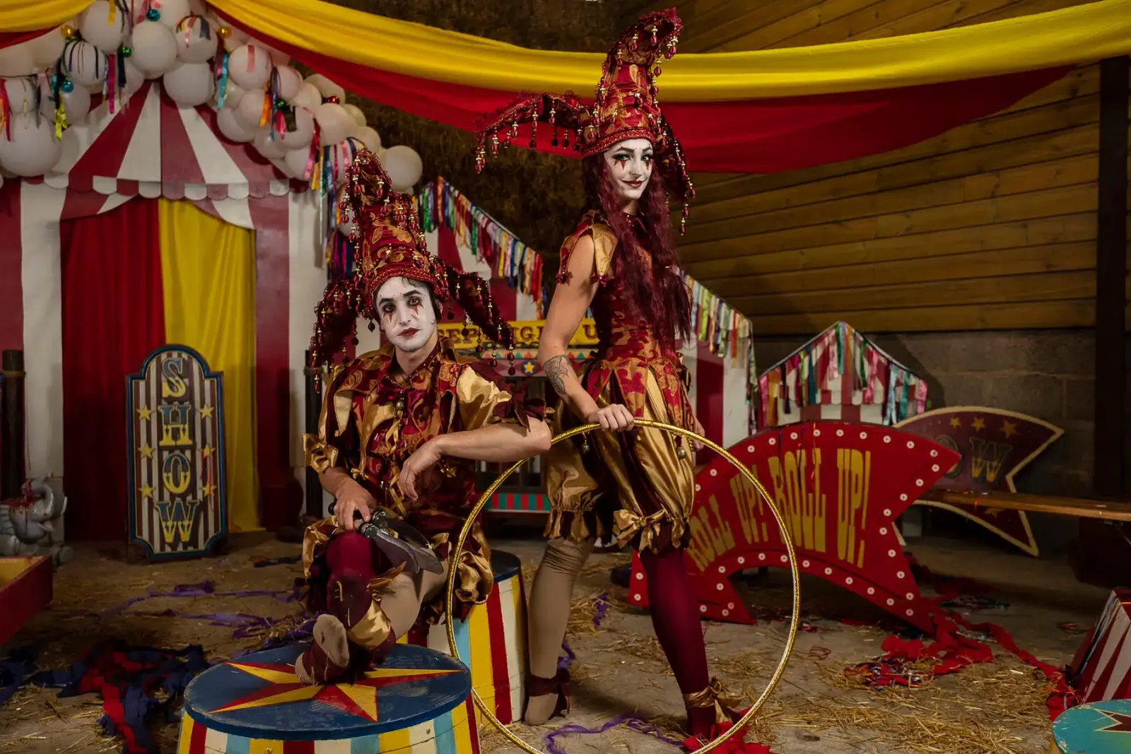 Jester performers entertaining guests at a themed celebration