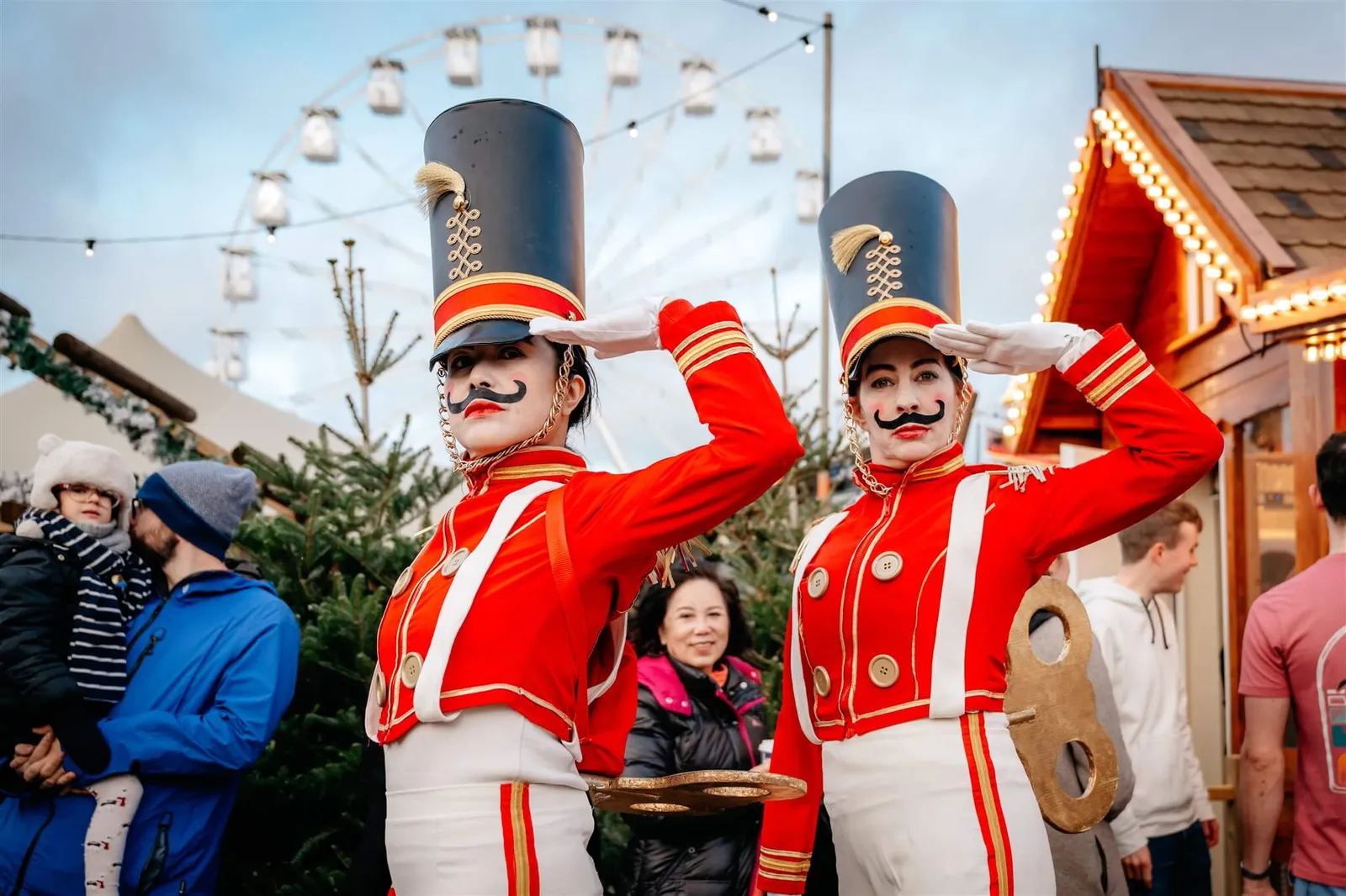Festive walkabout performers meeting guests at a Christmas market
