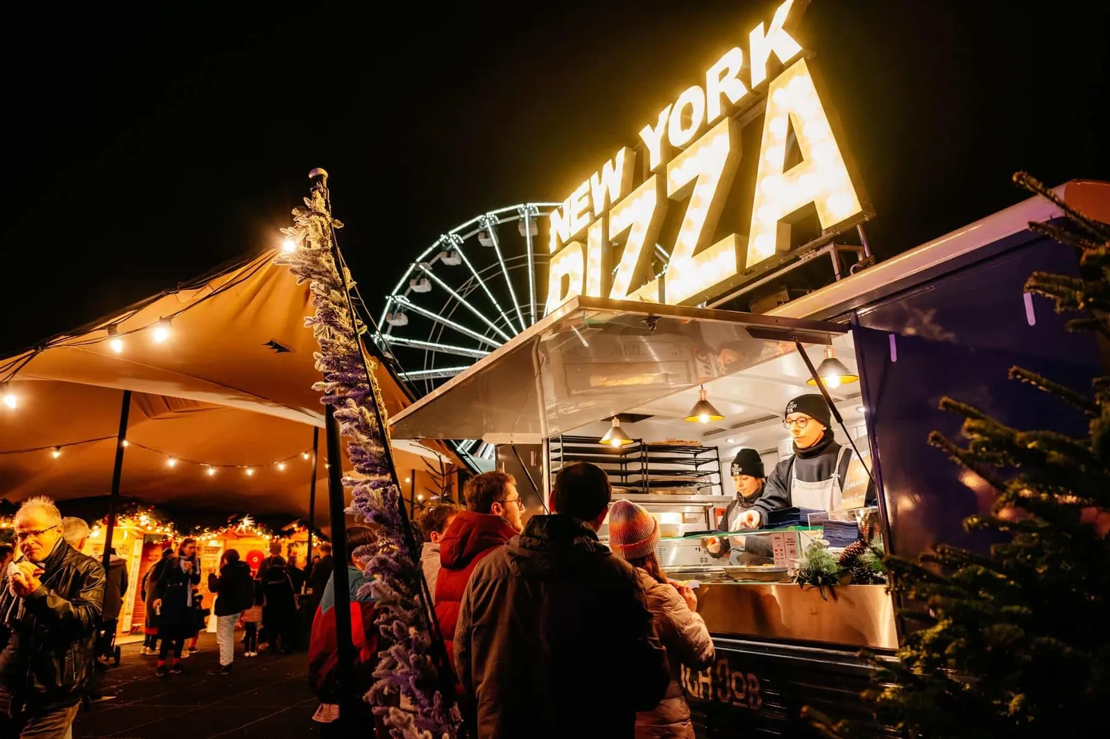 Street food pizza van serving guests at an outdoor staff party
