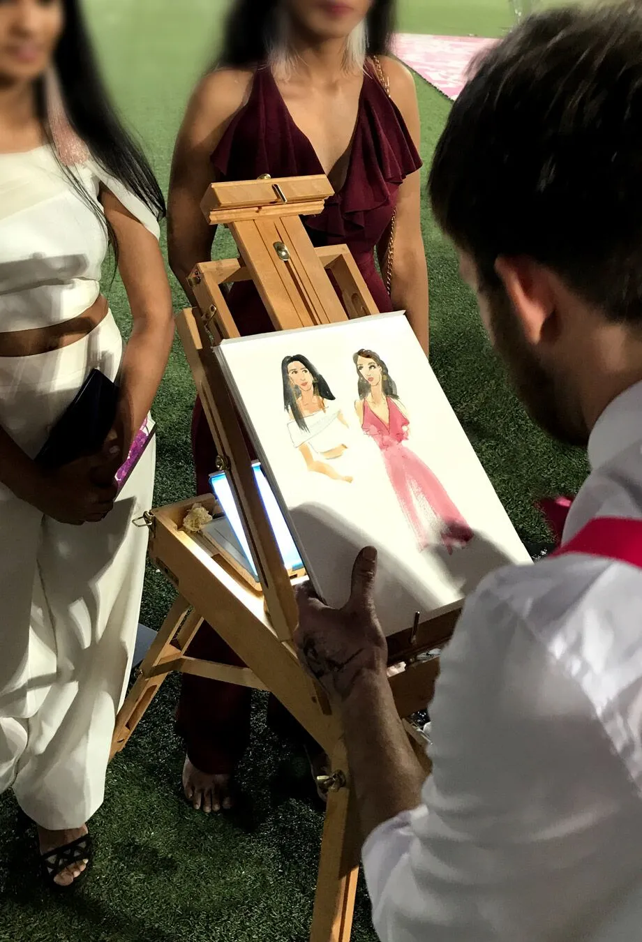 Live event illustrator painting a summer party scene