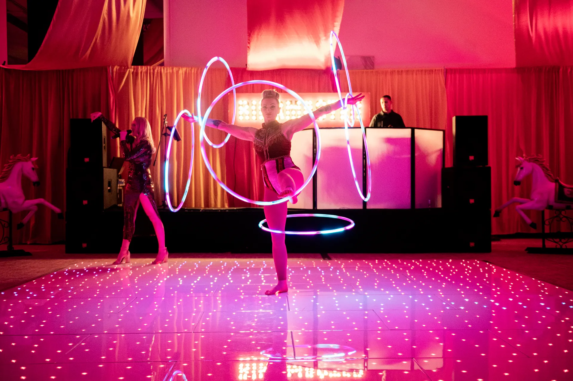 Singer and hula hooper LED: circus acts, circus showman theme