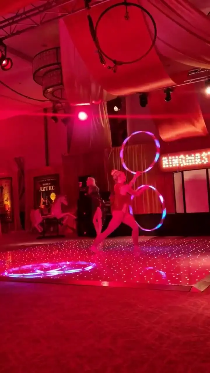Hula hooper performs with live singer: circus acts, circus showman theme