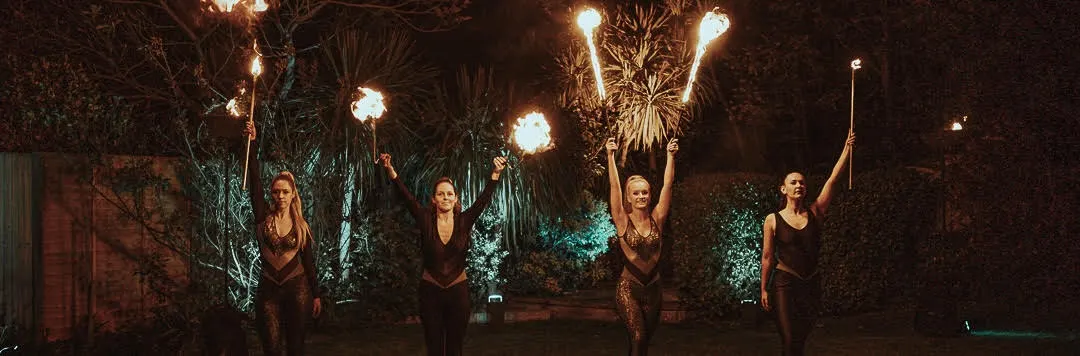 Costumes silver and black metallic catsuits: fire performers