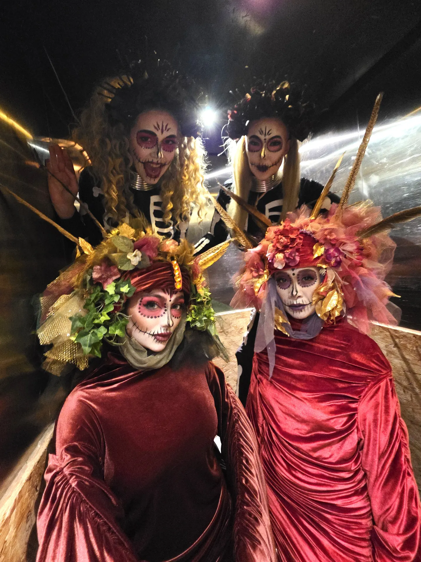 Floral venetians day of the dead with skeleton stilts: living statues
